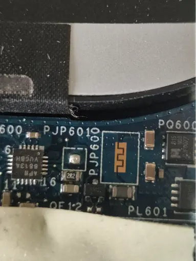 Close-up of PCB circuit board with SMD components during component-level repair