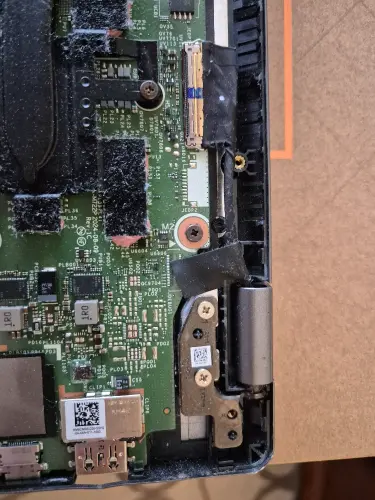 Laptop motherboard internal repair disassembly showing professional technician work