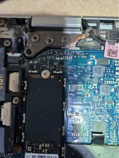 Laptop motherboard with M.2 SSD slot open ready for NVMe drive upgrade installation